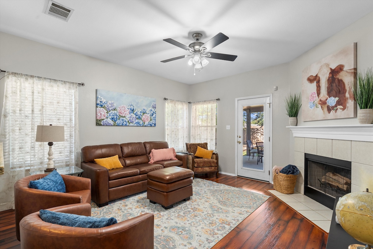 Cozy living room in Leander home with backyard games